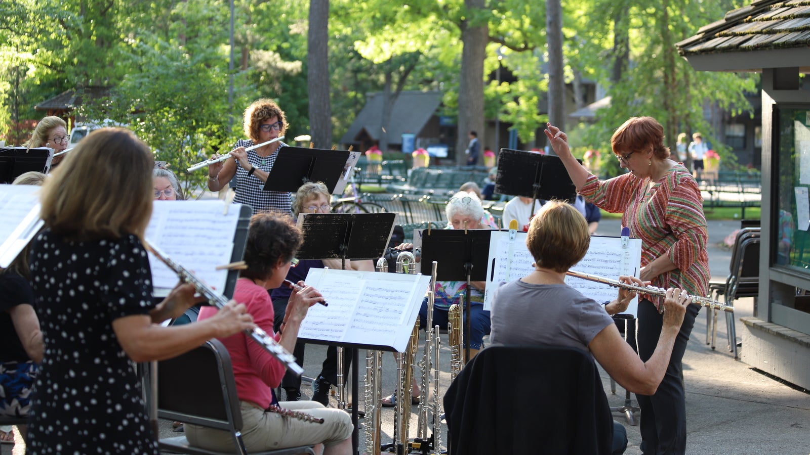 A flute choir playing outside