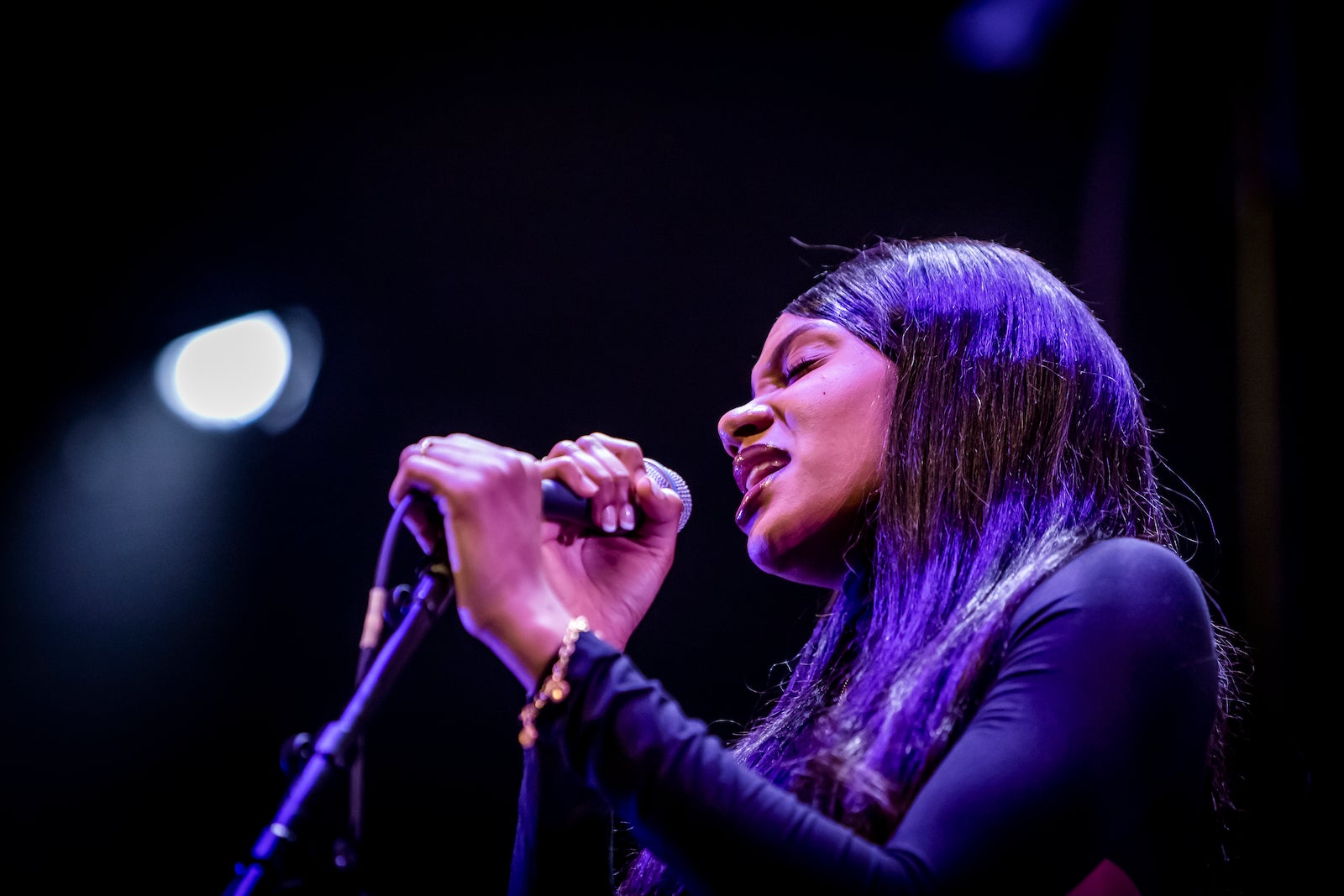 A woman singing on a stage