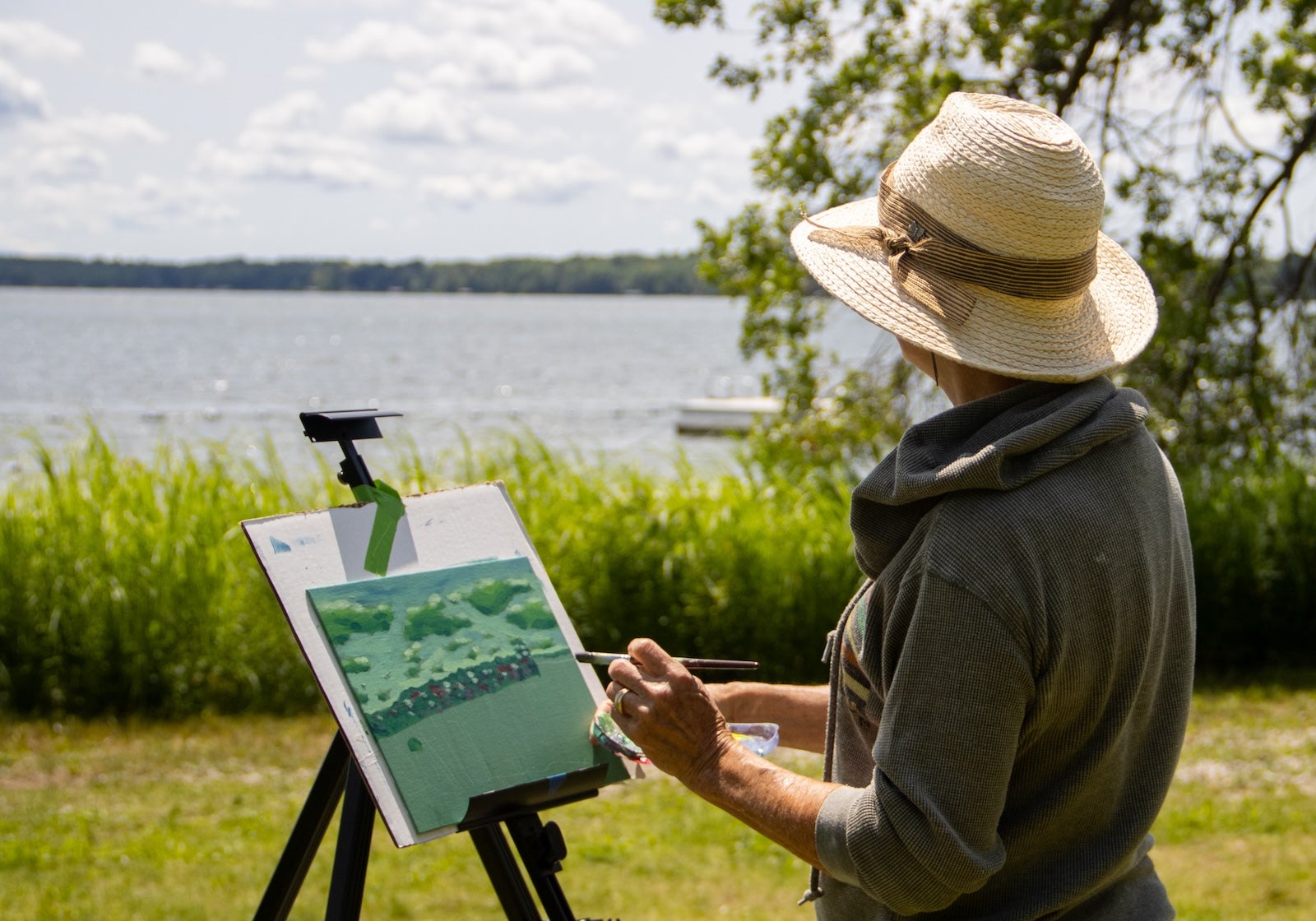 A women painting Interlochen's campus in the summer