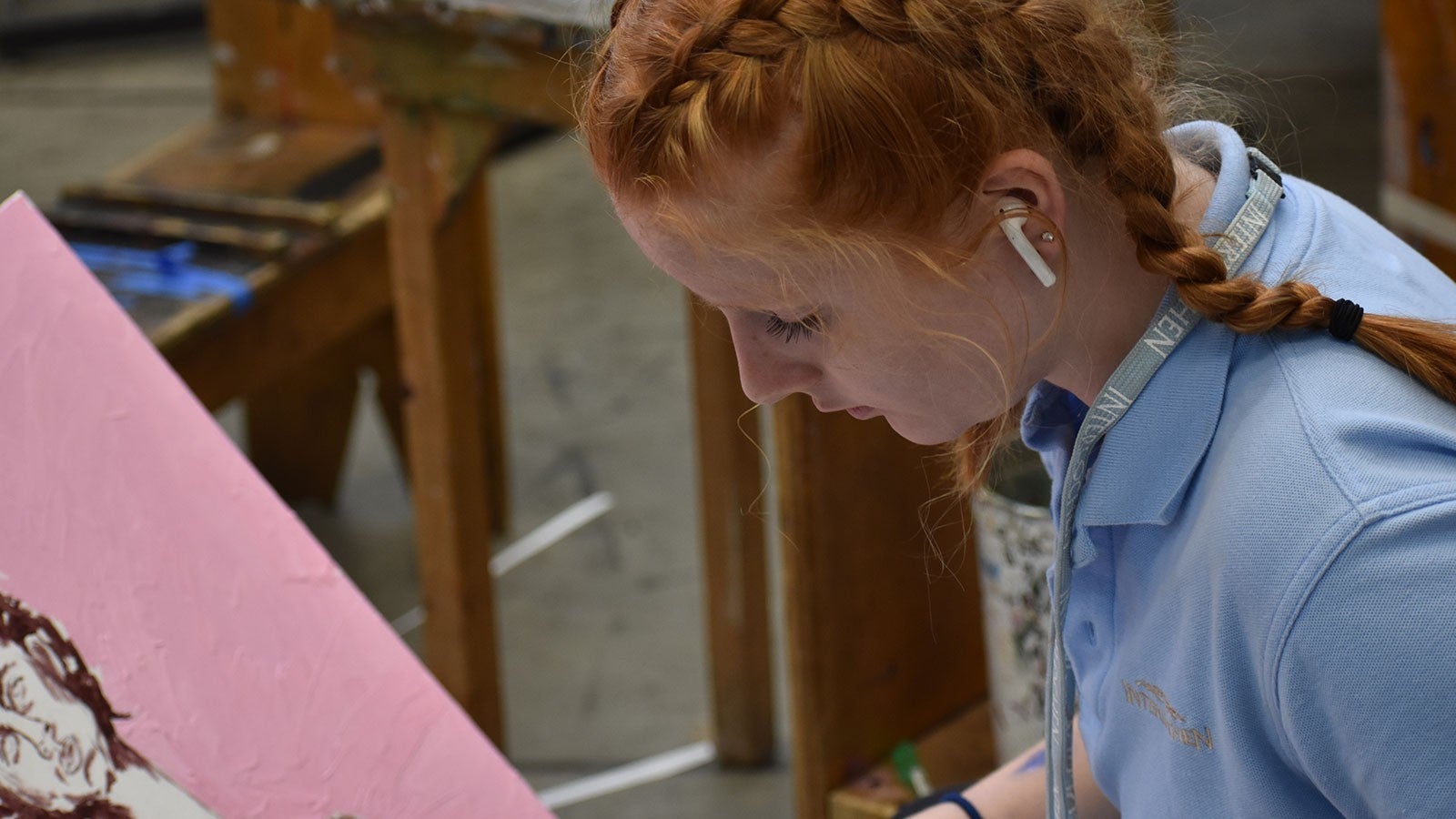 A girl works on a painting