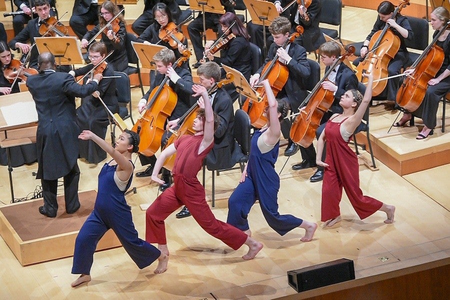 Interlochen dance students perform on stage with Interlochen orchestra students at Miami's New World Center