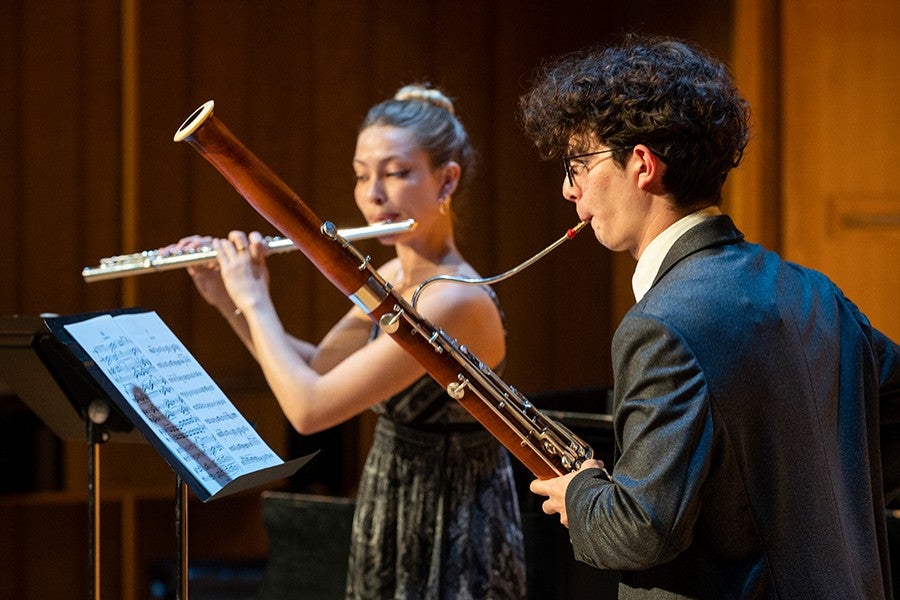 A bassoonist and a flutist play a duet