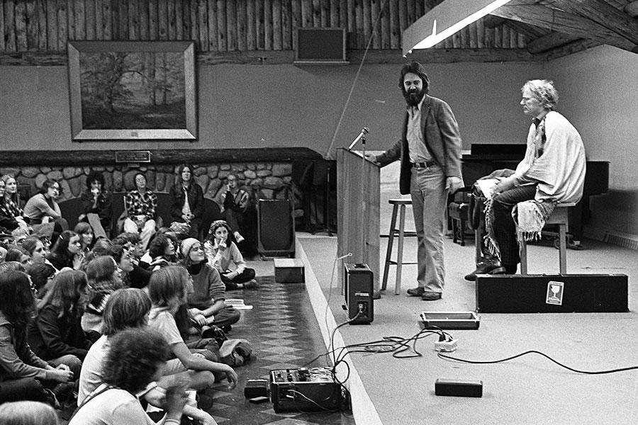 Driscoll introduces guest writer Robert Bly, 1975