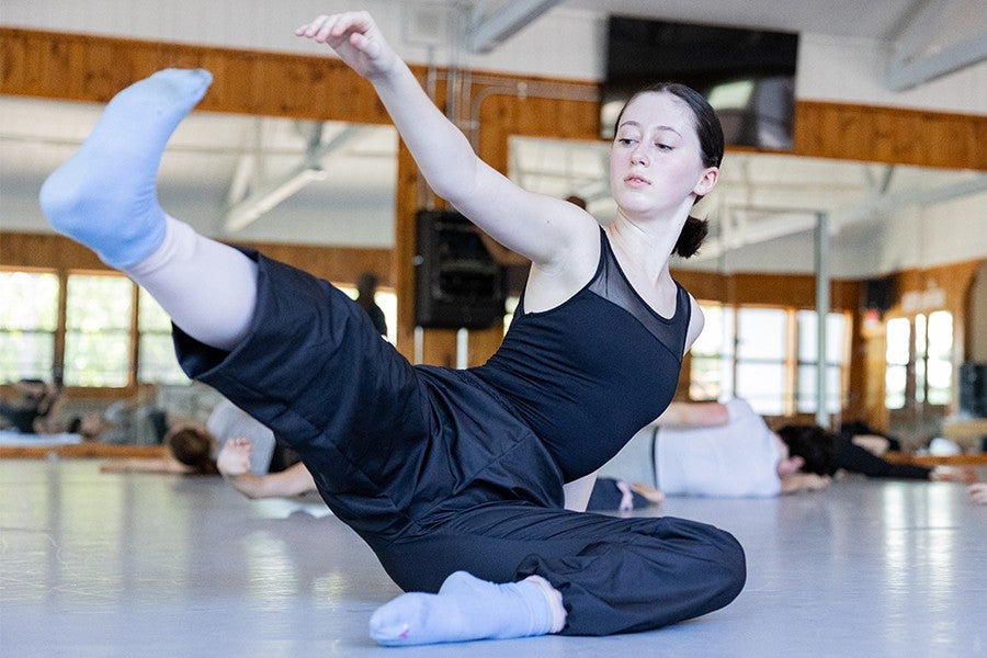 A contemporary dance student participates in a composition class.