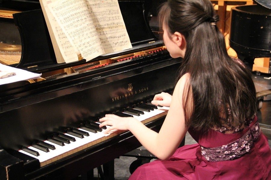 Interlochen Arts Academy student plays piano during a recital