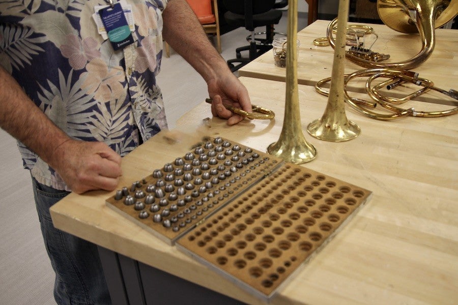 Image of a tray of beads used in trumpet repair