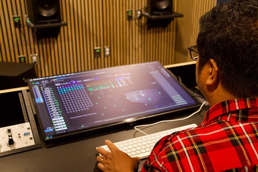 Lacuesta works on a song in the new Atmos room. 