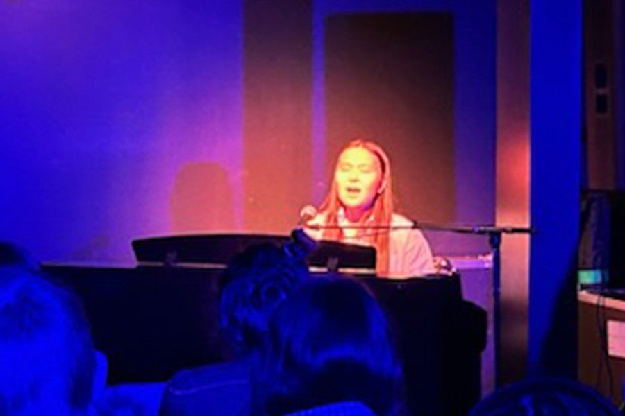 A student performs at a recent Open Mic event.