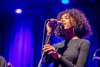 a student performing with a microphone