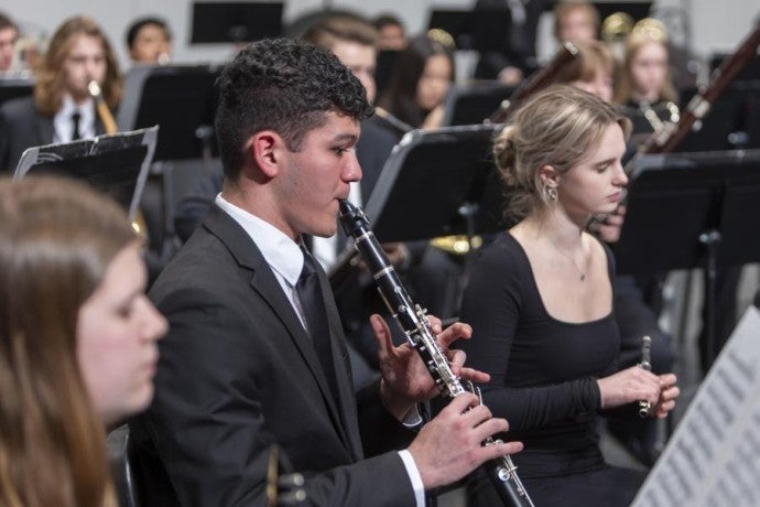 Interlochen Arts Academy student play clarinet during a Wind Symphony concert.