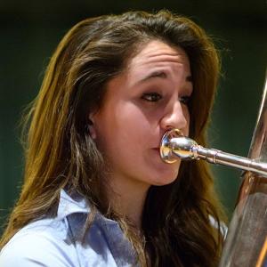 A girl playing the tuba