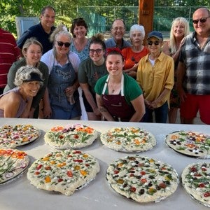 Participants in the summer 2022 focaccia class pose with their freshly made creations.